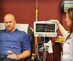 the miniER staff looking at a patients heart monitor