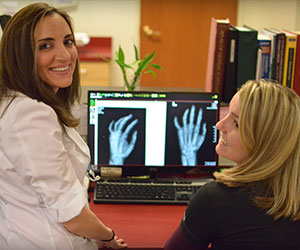 the miniER staff looking at a hand x-ray